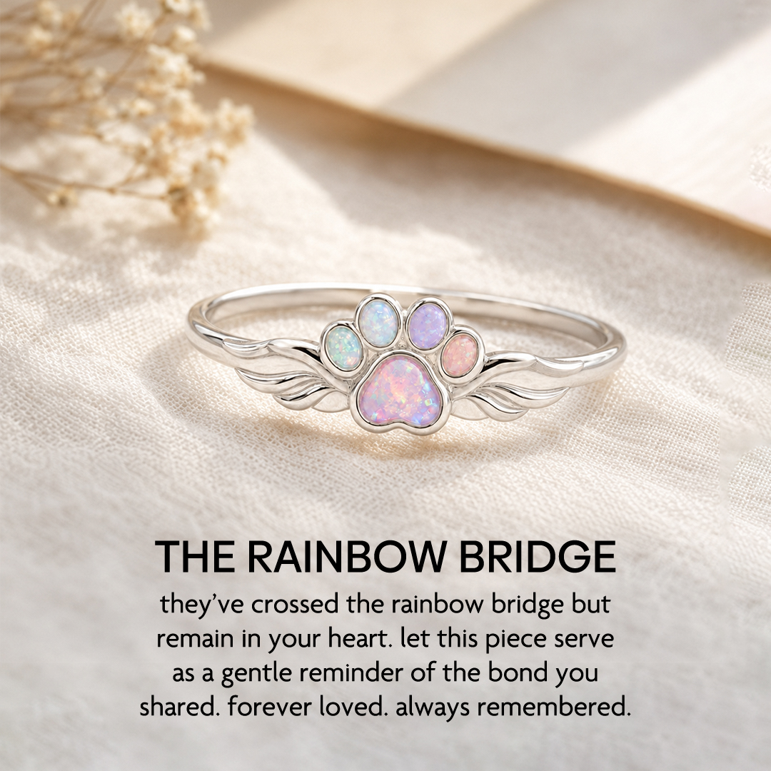 Image ad for a paw-shaped opal memorial ring from Olivia Handicrafts